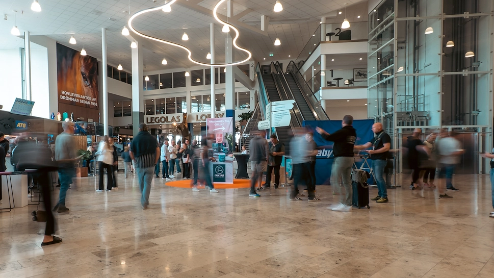 Blurry people in the event hall at Aby Arena